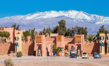 City gate in Morocco with snow-covered Atlas Mountains behind