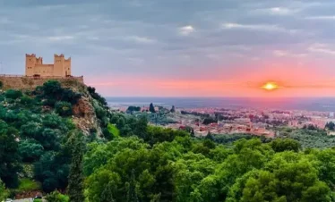 Moroccan fortress overlooking a forest at dusk
