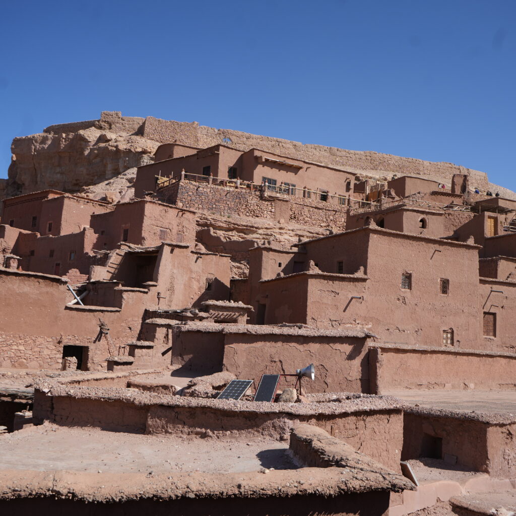 Historic Moroccan village built with reddish mudbrick walls