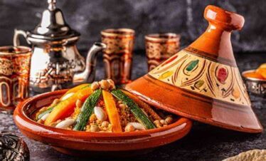 Colorful Moroccan plates mounted on a blue wall in Chefchaouen