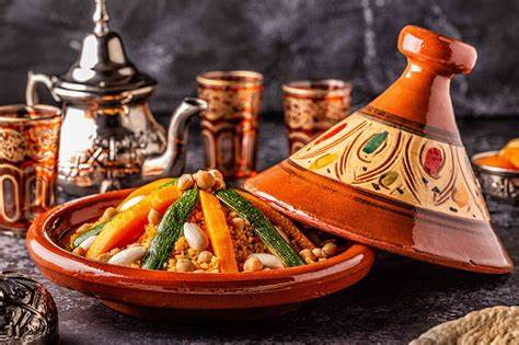 Colorful Moroccan plates mounted on a blue wall in Chefchaouen