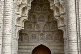 Ornate Islamic architectural arch with carvings