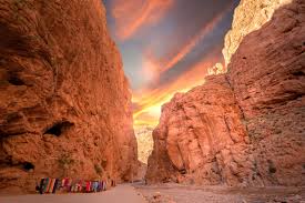 Fiery sky illuminating the towering cliffs of Todgha Gorge in Morocco