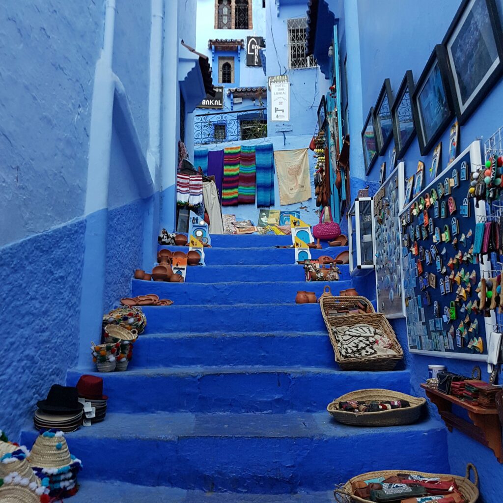 About Us - Hayya Morocco Narrow blue-painted street with steps