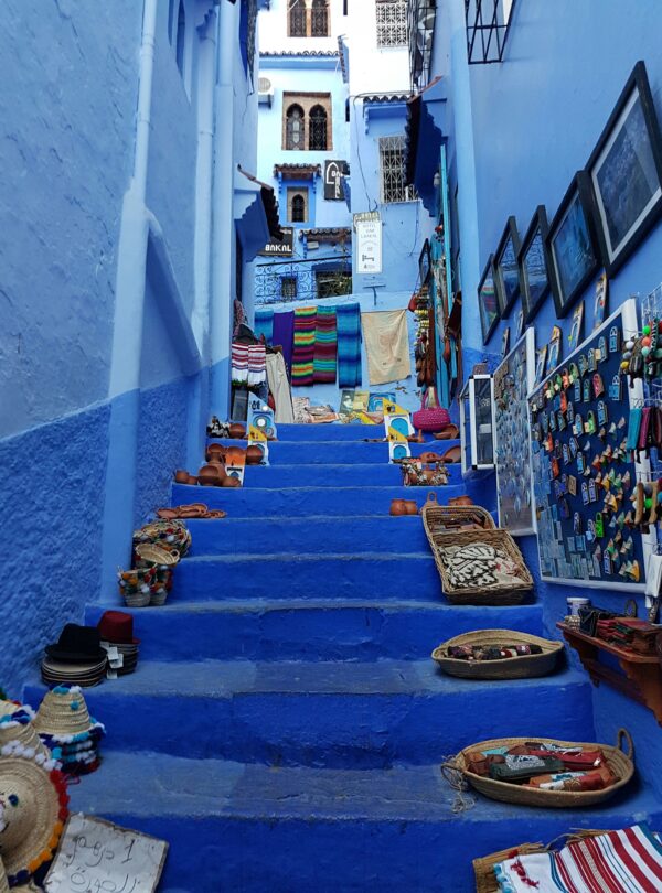 Narrow blue-painted street with steps