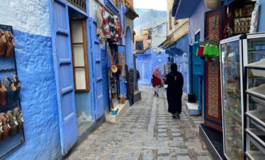 Blue fishing boats floating in harbor in Morocco