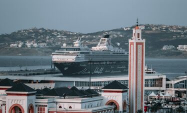 Traditional Moroccan home with blue stairs and white walls Caption: Beautifully painted home blending Moroccan and Andalusian styles