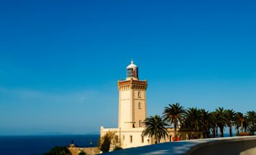 Traditional Moroccan textiles hanging outside a souk shop in Chefchaouen