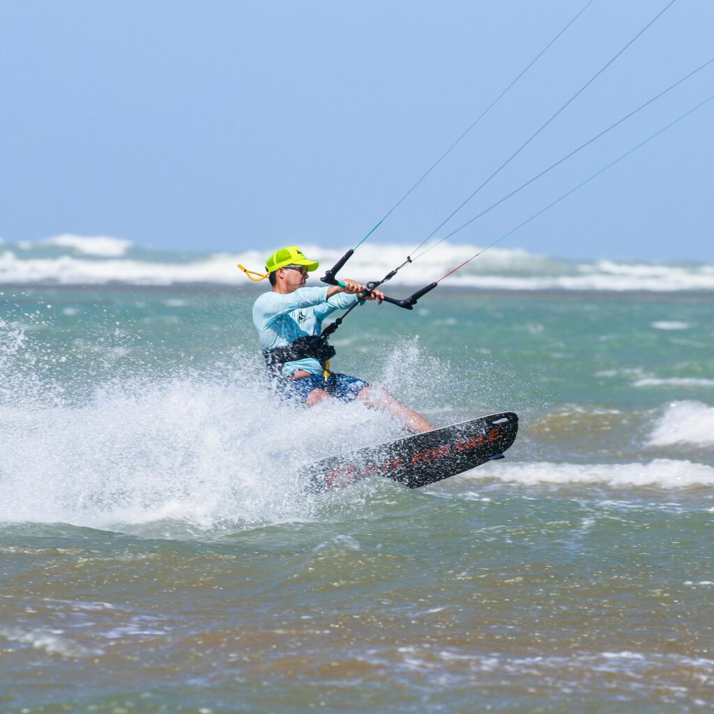 Kitesurfer riding waves on the Atlantic coast