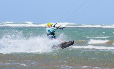 Kitesurfer riding waves on the Atlantic coast