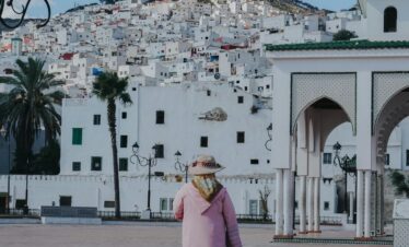 Still lake reflecting green hills in the Moroccan mountains
