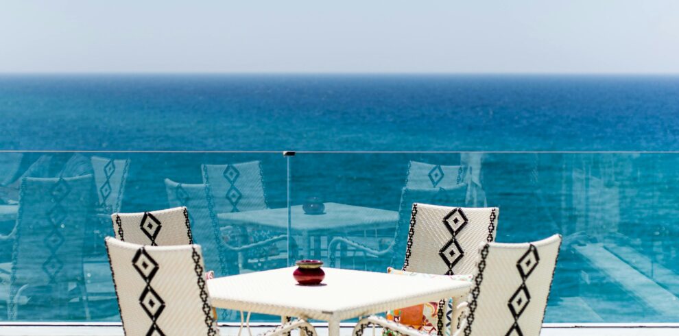 Moroccan outdoor café with ocean view and white furniture