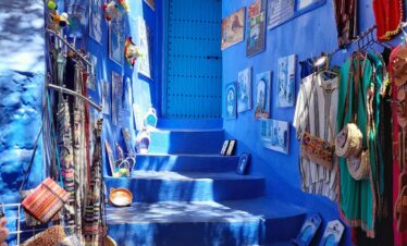 Blue staircase decorated with potted plants in Chefchaouen
