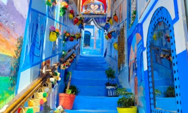 Narrow alley painted in various shades of blue in Chefchaouen