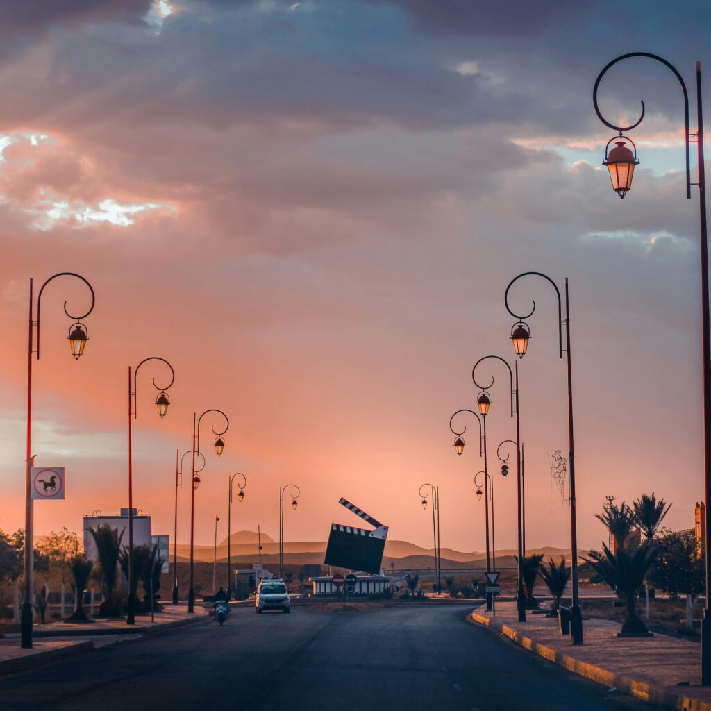 Sunset boulevard with streetlamps in coastal Morocco