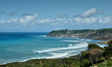 Ornate Moroccan door painted blue with ceramic tile accents