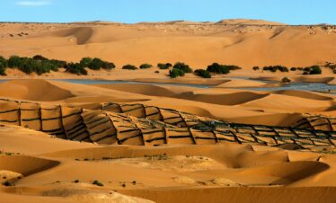 Golden Moroccan sand dunes with wind-carved ridges