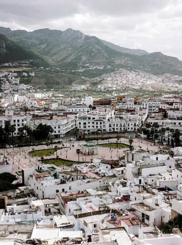 White buildings nestled in lush green mountains