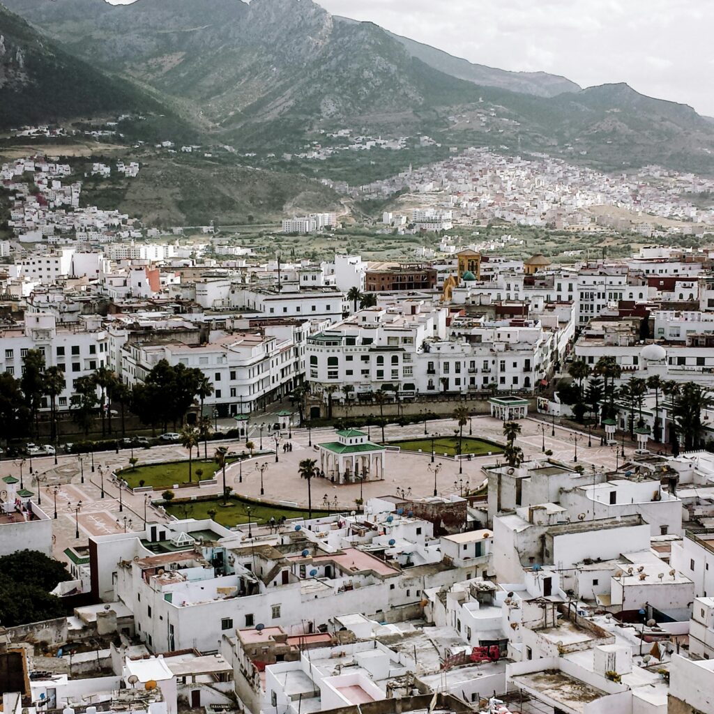 Moroccan city at the base of green mountains