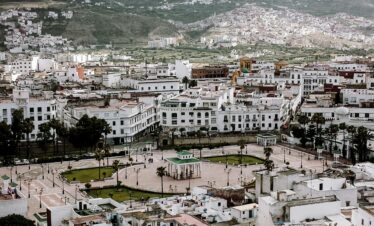 Moroccan city at the base of green mountains