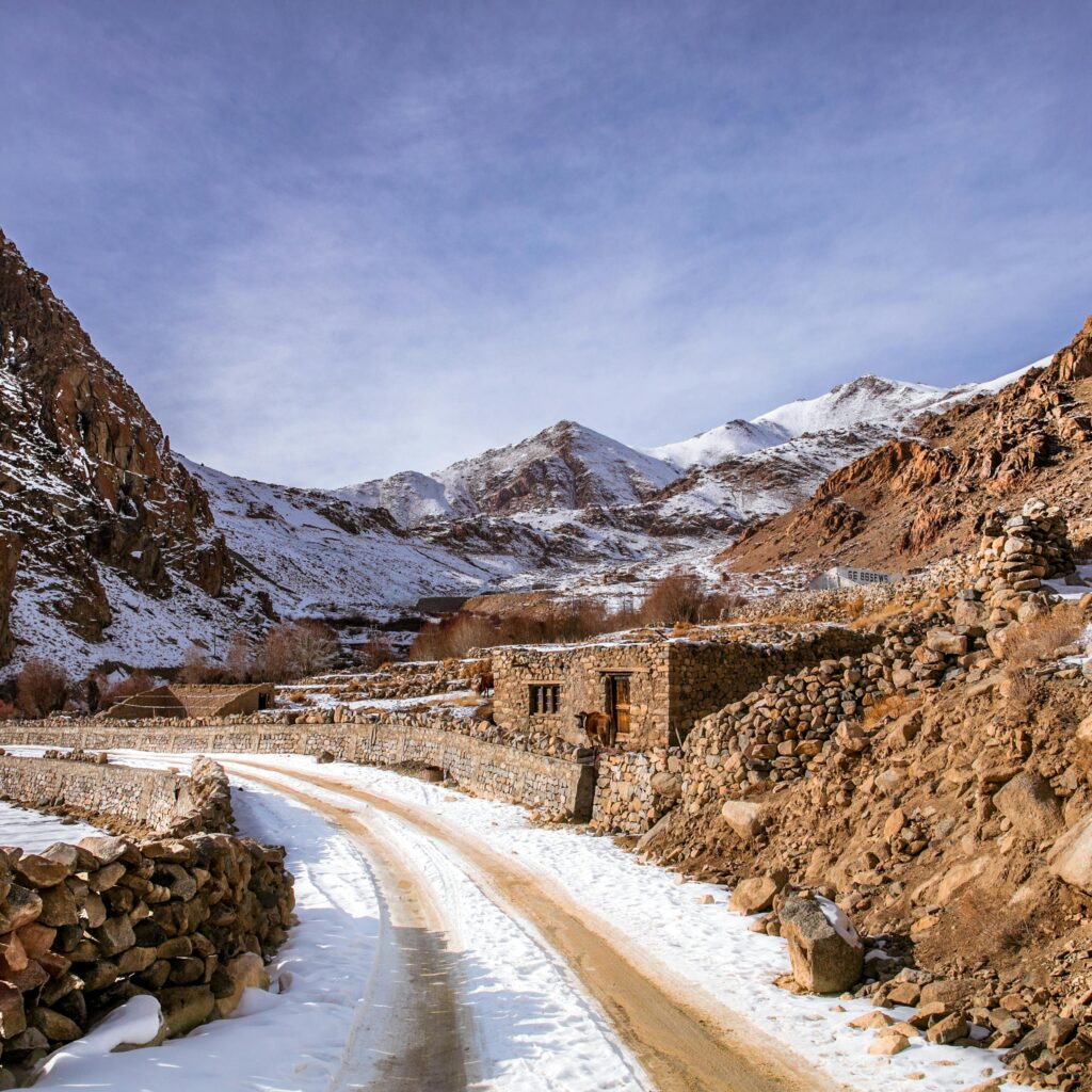 Winding road through snowy Atlas Mountains in Morocco