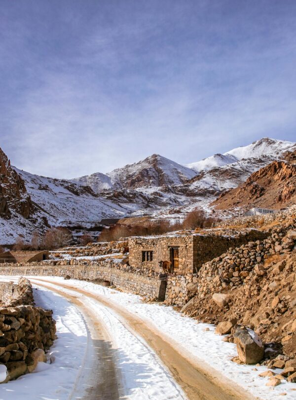Winding road through snowy Atlas Mountains in Morocco