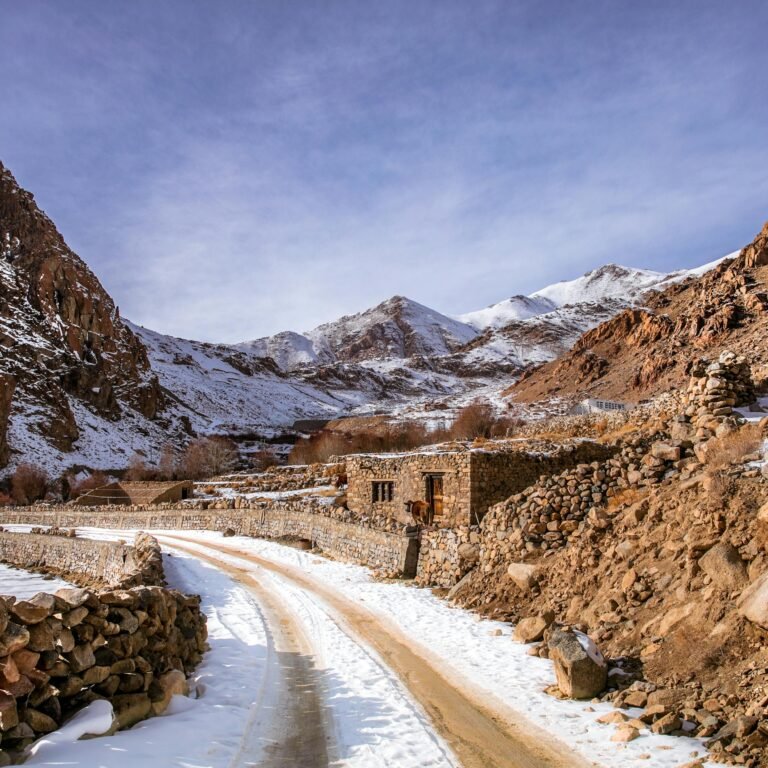 Winding road through snowy Atlas Mountains in Morocco