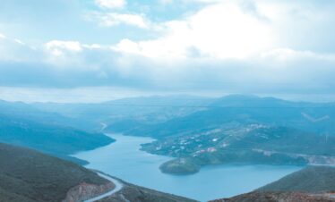 People walking through a narrow Moroccan canyon