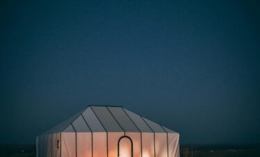 Illuminated luxury tent in Moroccan desert at night