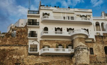 Blue alley in Chefchaouen illuminated by golden evening light
