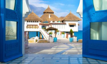 Curved archway and steps painted blue in Moroccan medina