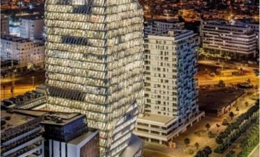 Tall modern towers illuminated at night