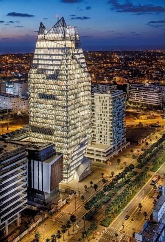 Tall modern towers illuminated at night