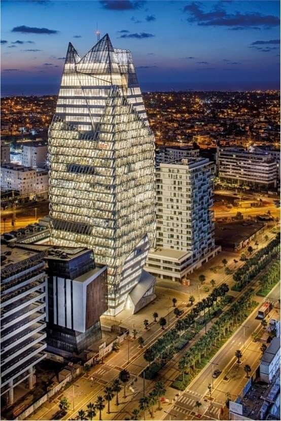 Tall modern towers illuminated at night