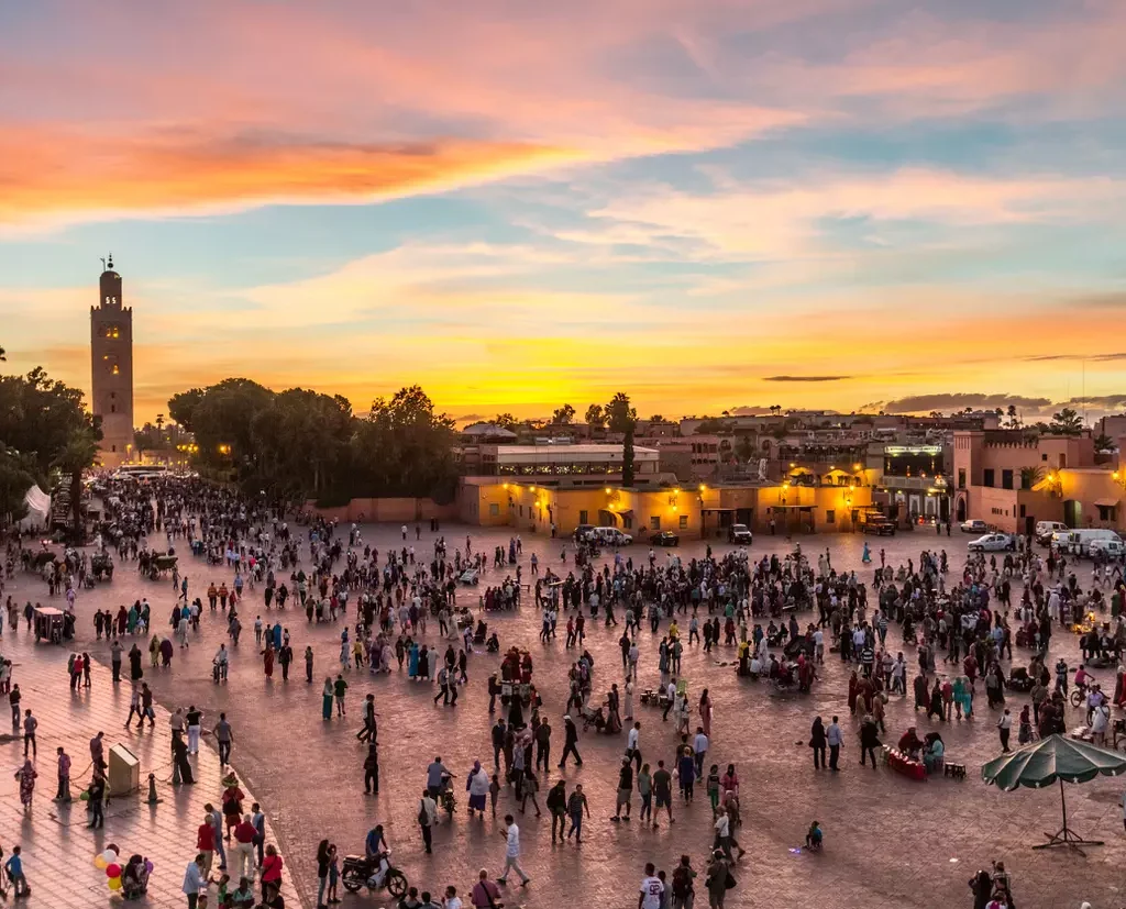Crowded Jemaa el-Fna with food stalls