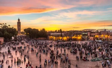 Crowded Jemaa el-Fna with food stalls
