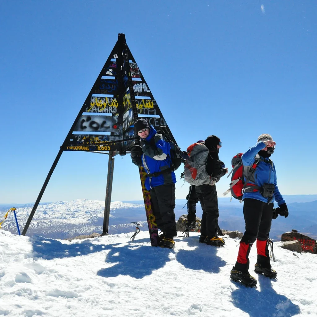 Hikers posing at Toubkal’s summit