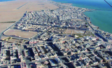 Top-down shot of a Moroccan town by the ocean