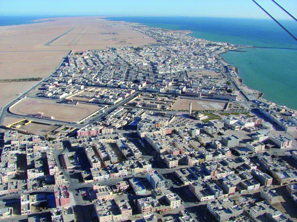 Top-down shot of a Moroccan town by the ocean