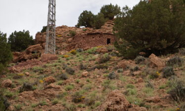 Lush green valley surrounded by rocky hills in Morocco.