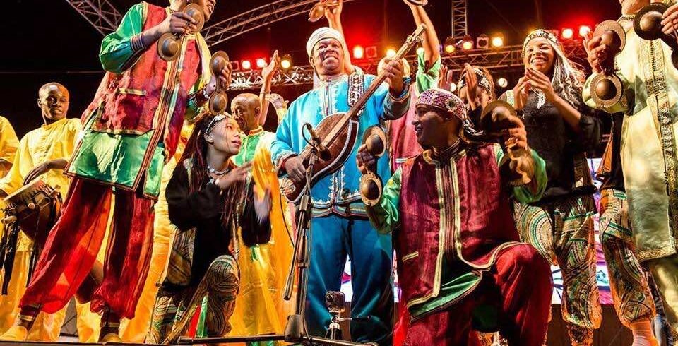 Dancers in colorful traditional outfits performing a folk dance.
