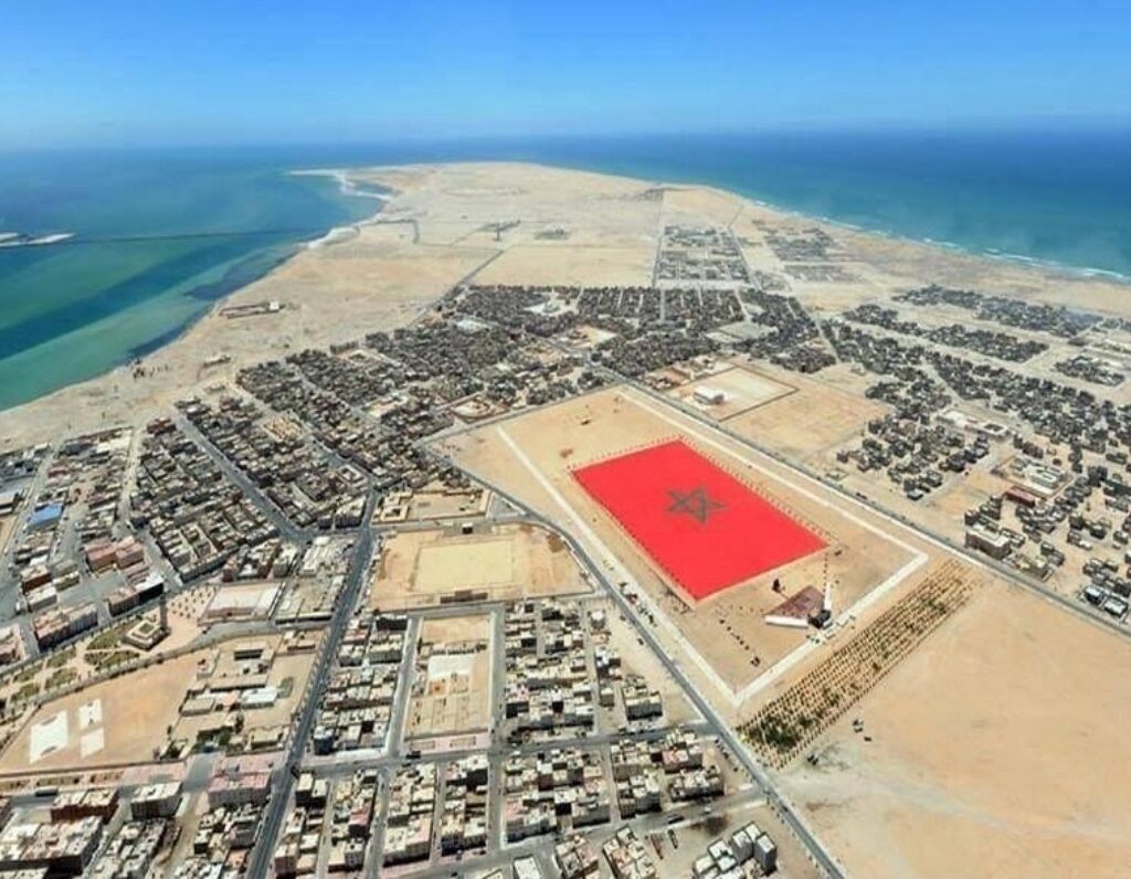 Drone shot of Dakhla city and flag