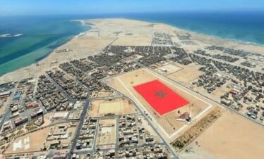 Drone shot of Dakhla city and flag