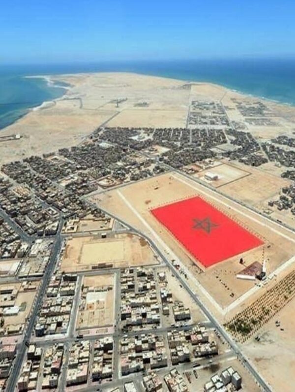 Drone shot of Dakhla city and flag