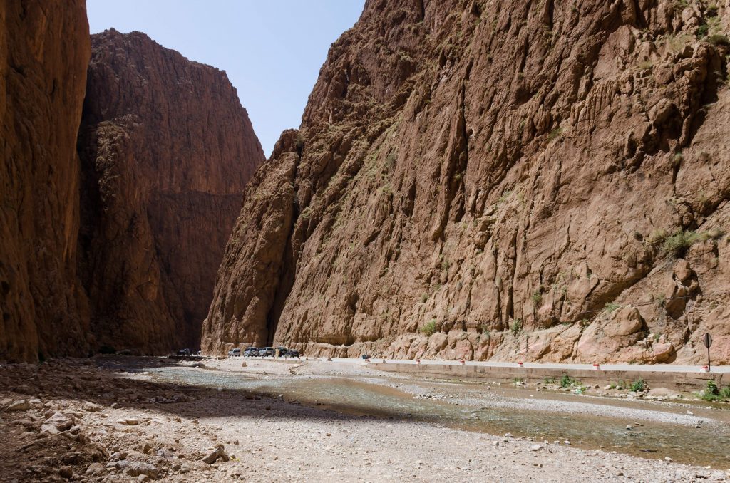 Rocky canyon walls and a walking path in Todgha Gorge.