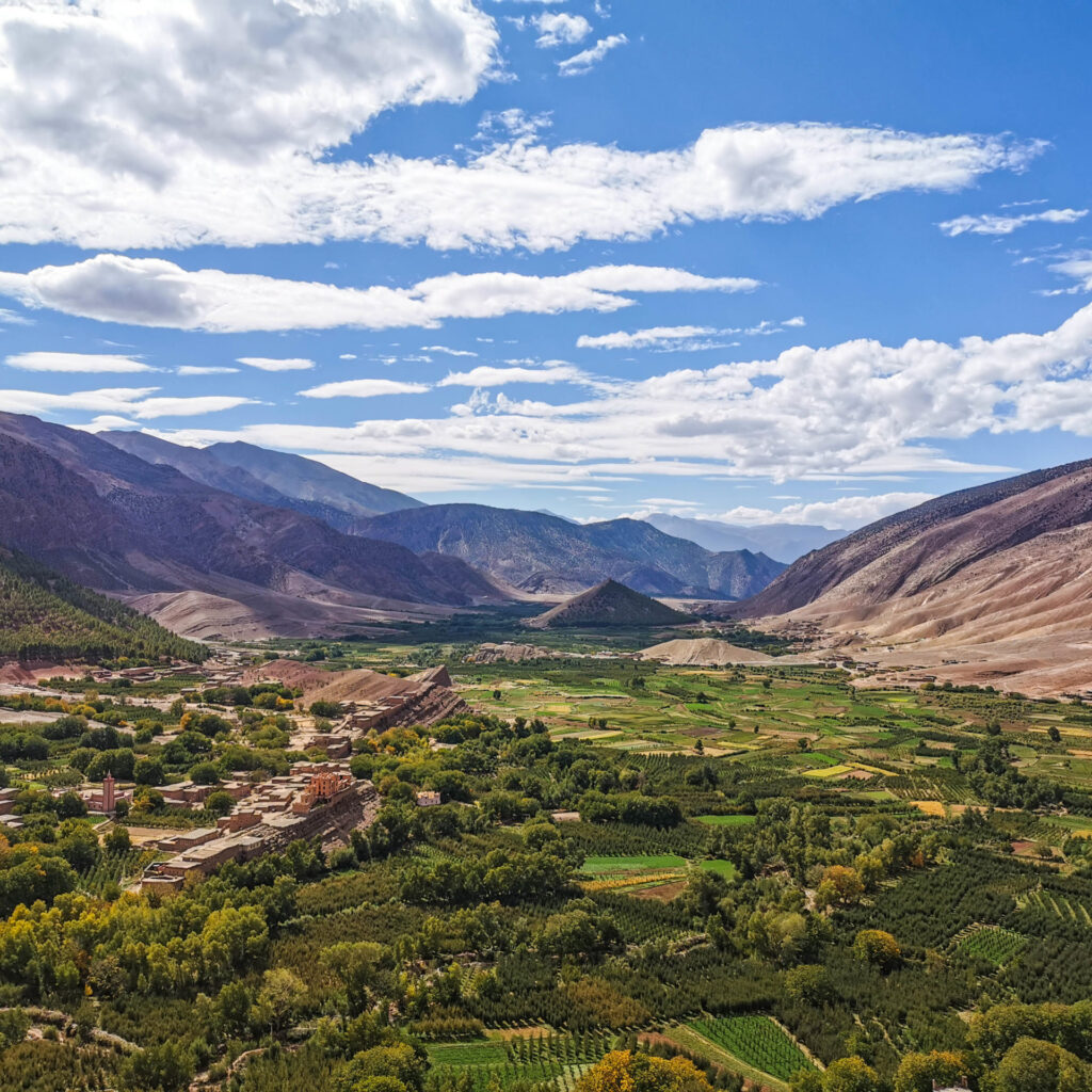 A broad, fertile valley with agricultural terraces.