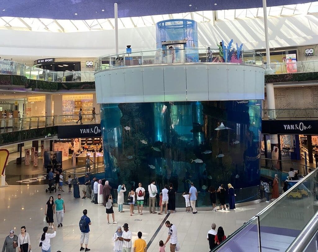 Large cylindrical aquarium inside mall