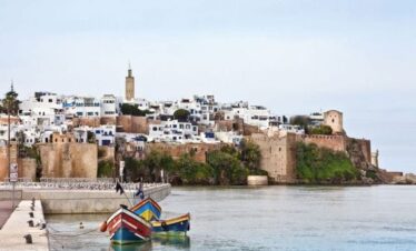 Scenic river view in Rabat with boats and cityscape