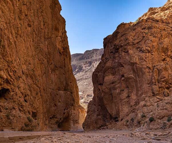 Natural rock cave tunnel in a Moroccan canyon.