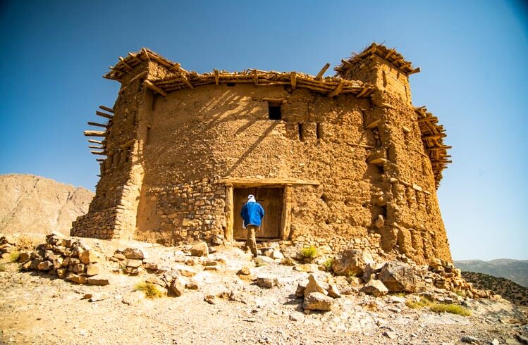 Old-style Berber house with mud walls in rural Morocco.